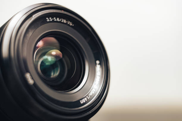 istock Close up beautiful camera lens on a gray background. 1210376643