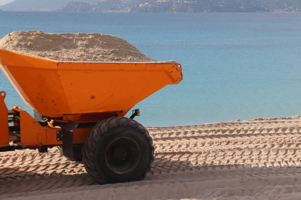 istock Orange Tractor on the beach in Cannes 1210377424