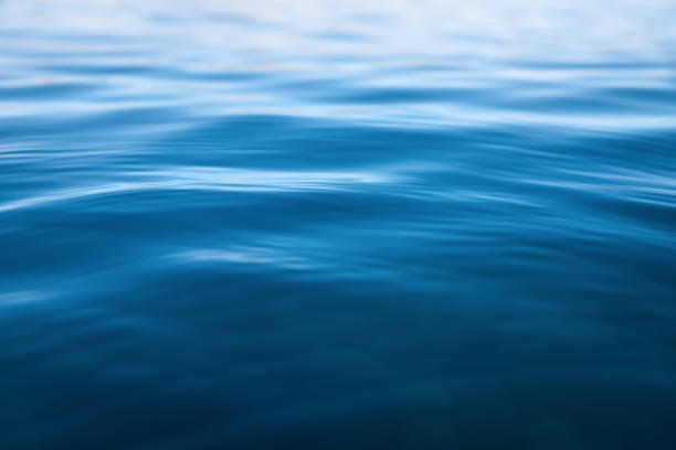Soft Water Background Close-up of rippled sea surface. water surface stock pictures, royalty-free photos & images