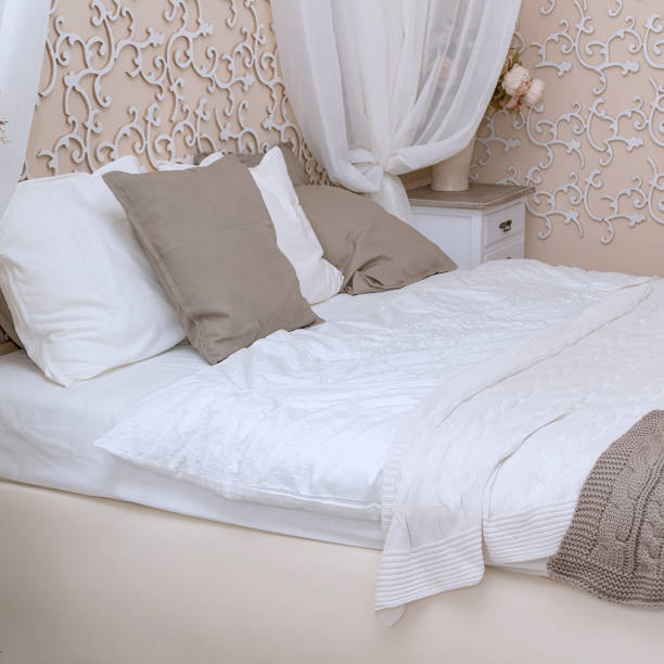 istock Double bed in the bedroom with two pillows 1210382698