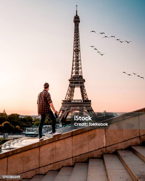 Young Men Watching Eiffel Tower In Paris Guy Tourist Visiting Paris France By Eiffel Tower Stock Photo - Download Image Now