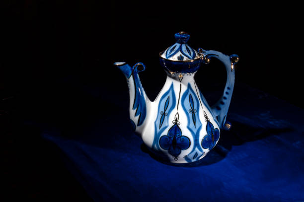 istock Oriental style coffee pot on a blue background 1210387645