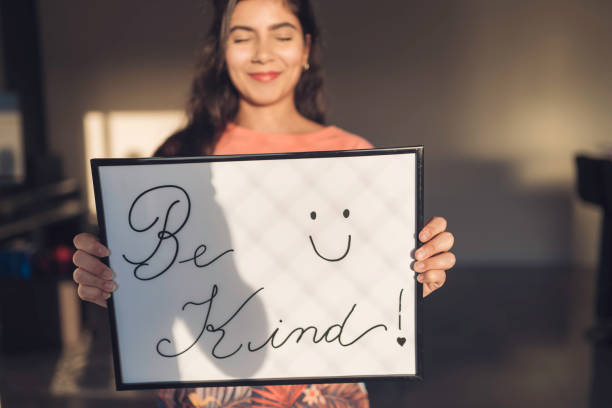 istock Young Woman Handheld Sign 1210391504