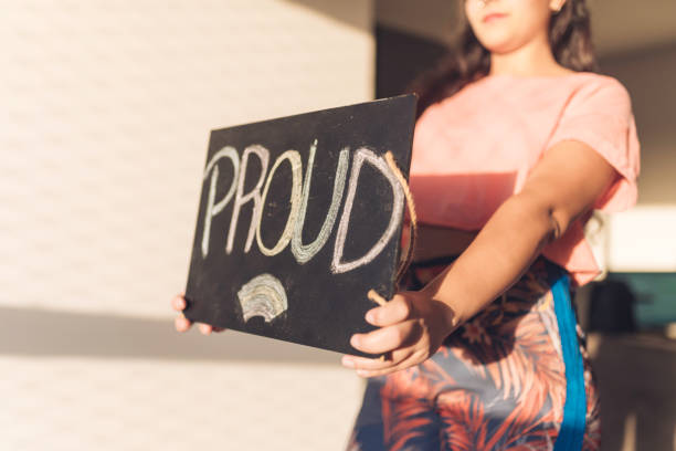 istock Young Woman Handheld Sign 1210391521