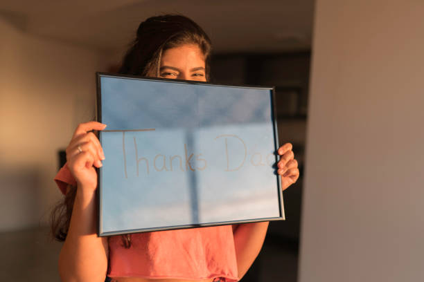 istock Young Woman Handheld Sign 1210391533