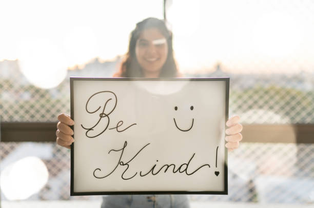 istock Young Woman Handheld Sign 1210391557