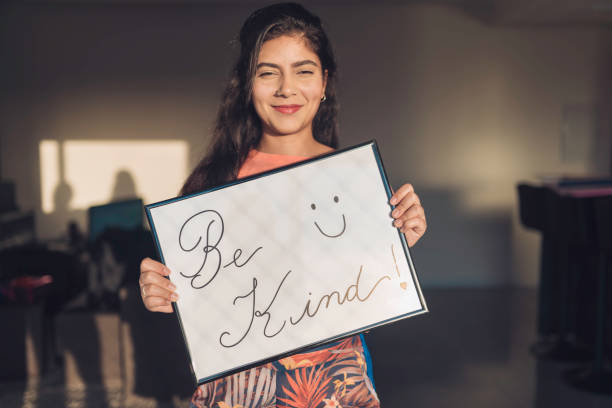 istock Young Woman Handheld Sign 1210391567