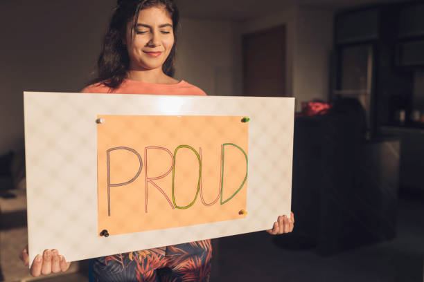 istock Young Woman Handheld Sign 1210391576