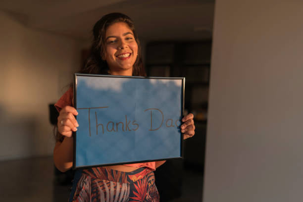 istock Young Woman Handheld Sign 1210391605