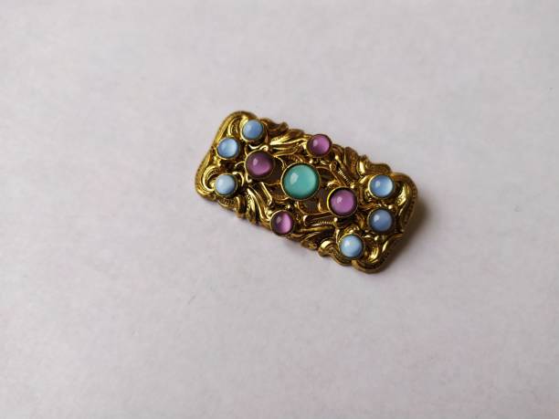 istock Old vintage brooch isolated on a white background 1210391610