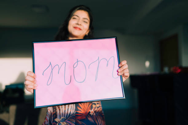 istock Young Woman Handheld Sign 1210391639