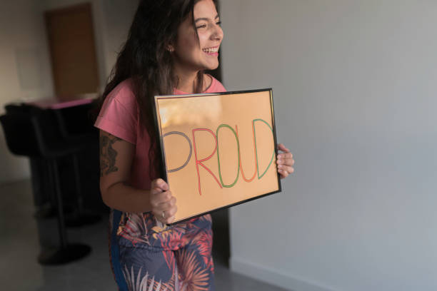 istock Young Woman Handheld Sign 1210391667