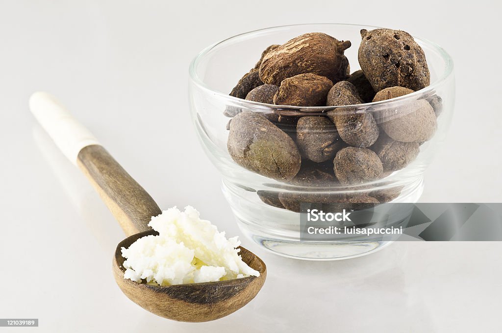 spoon with shea butter and nuts  Shea Stadium Stock Photo