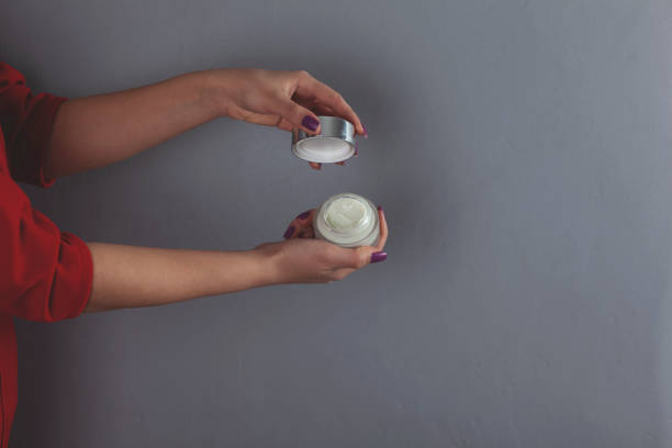 istock woman hand cream 1210392950