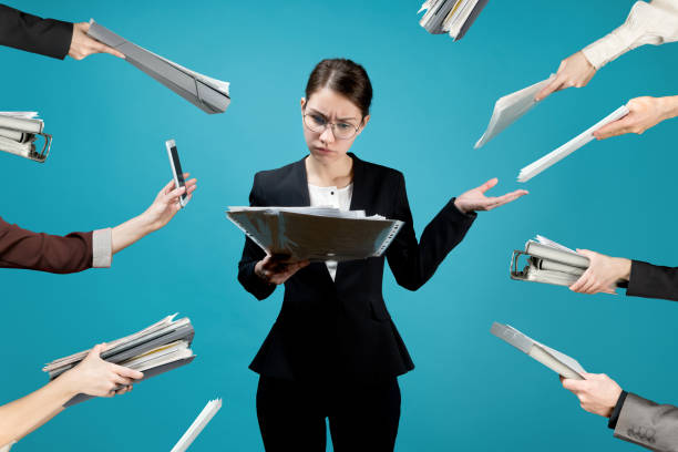istock Director is loaded with documents by colleagues and subordinates. 1210394016