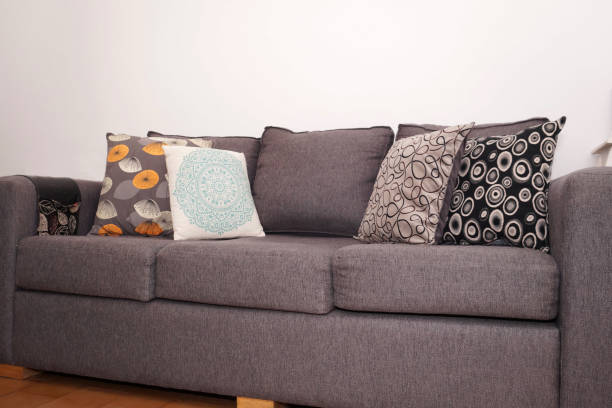 istock Large couch with  colorful pillows 1210397076