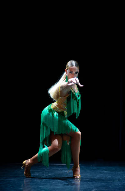 istock young beautiful female dancer posing on black background 1210399903