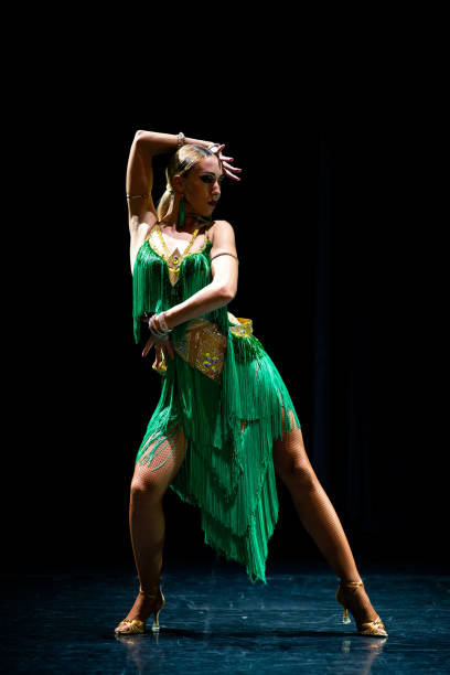 istock young beautiful female dancer posing on black background 1210400014