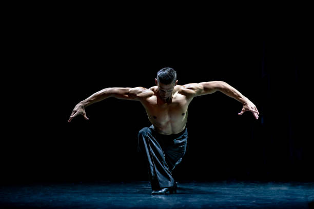 istock Muscular ballroom dancer topless making pose isolated on black background 1210400088