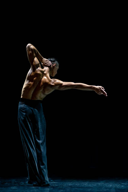 istock Muscular ballroom dancer topless making pose isolated on black background 1210400107
