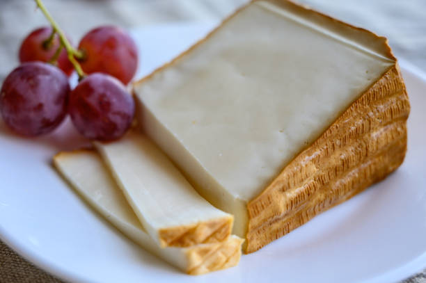 Cheese collection, piece of smoked Spanish goat cheese close up