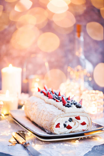 istock Meringue roll cake with cream and fresh berries 1210401953