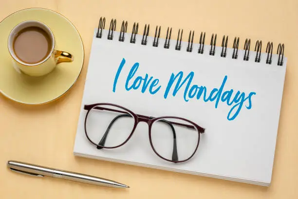 I love Mondays - handwriting  in a sketchbook with a cup of coffee, positive attitude and mindset concept