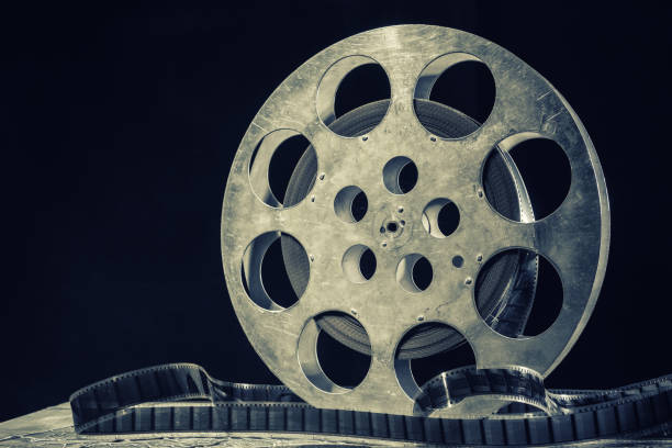 istock 35 mm film reel with dramatic lighting on a dark background 1210405046