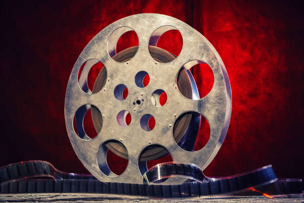 istock 35 mm film reel with dramatic lighting on a dark background 1210405131