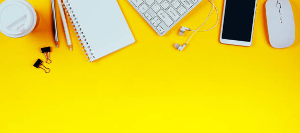 istock White keyboard, mouse and Notepad on light yellow background. Flat lay and top view, copy space for text 1210405257