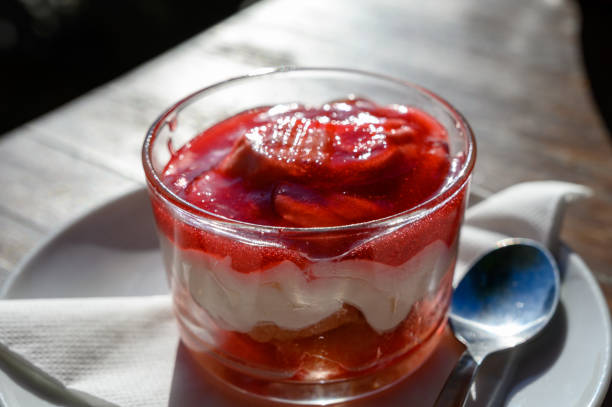 Fruit yogurt with fresh strawberries, close up