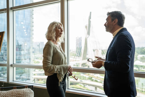 istock Business partners talking at office 1210408441