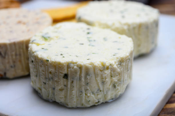 istock Spread cream cheese with herbs, garlic, chives and spices close up 1210408507
