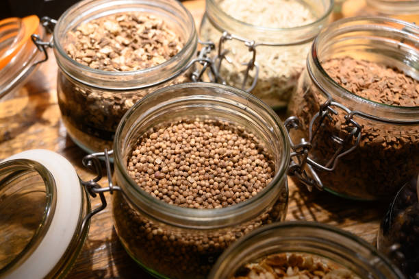 istock Tastes of gin, botanicals ingredients for gin distillery process, dried orange peels, juniper berries, heather, angelica, coriander, clove, cassia, liquorice 1210408656