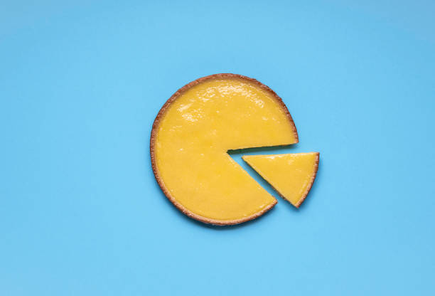istock Lemon pie on blue background above view. Sliced pie 1210409174