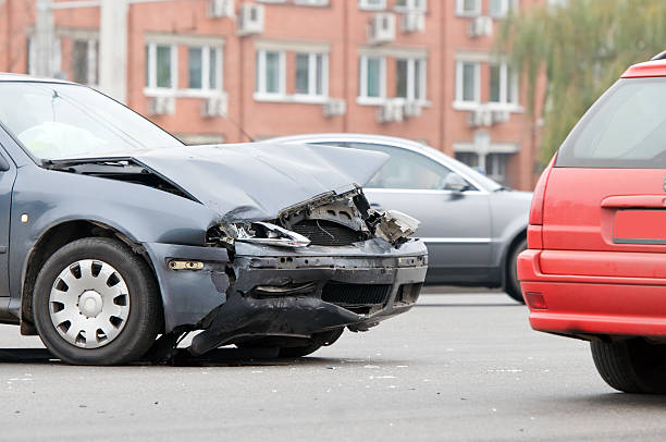 istock Damaged front side of a vehicle after a crash 121040939