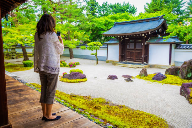 istock Woman taking selfie at Japanese temple 1210409904