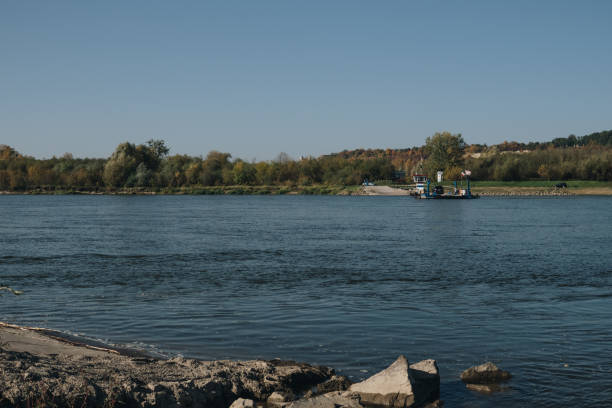 inland ferry carrying a car on Vistula river in Janowiec 14.10.2019, Janowiec, Poland: inland ferry carrying a car on Vistula river in Janowiec janowiec poland stock pictures, royalty-free photos & images