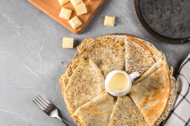istock Crepes with poppy seed and white chocolate sauce 1210415217