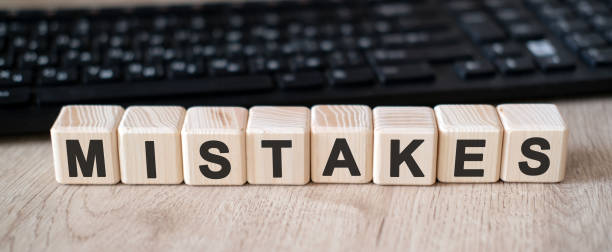 istock MISTAKES text on wooden cubes. Business concept 1210415576