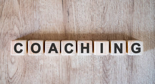 coaching text word on wooden cubes on wooden background - teaching advice education single word imagens e fotografias de stock