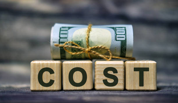 istock COST word concept on cubes with a Banknote 1210415601