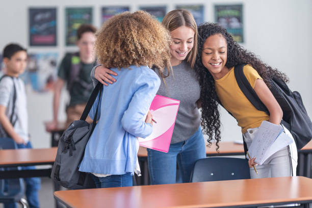 istock Friends greet each other in class 1210416467