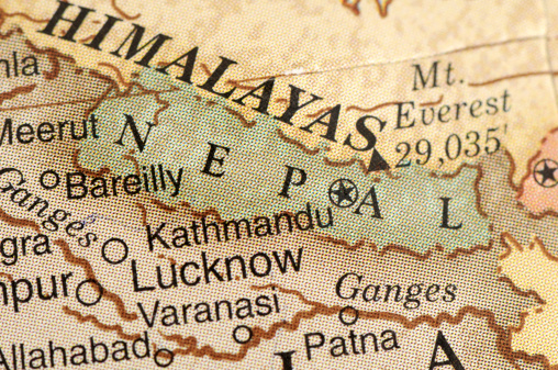 A close-up/macro photograph of Nepal and the Himalayas from a desktop globe. Adobe RGB color profile.
