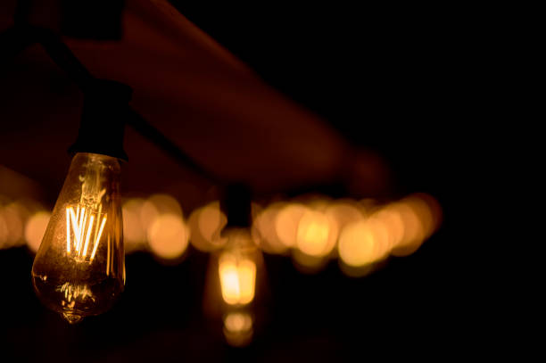 istock bulbs and defocused lights on a terrace at dusk 1210419613