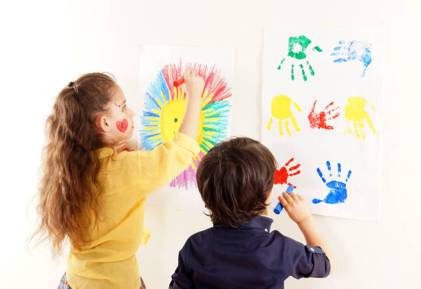 istock Little girl and boy are doing paint 1210420536