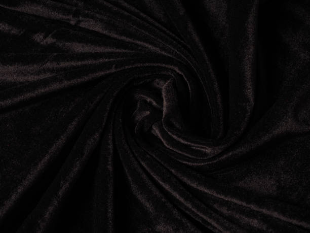 istock Closeup twisted coiled spiral black velvet background texture 1210421999
