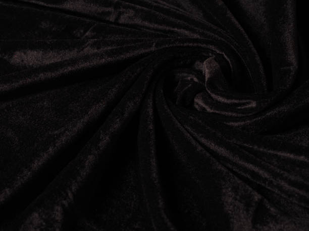 istock Closeup twisted coiled spiral black velvet background texture 1210422005