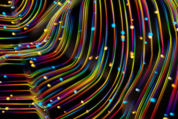 istock Neon glowing twisted cosmic lines on the glossy surface. Turbulence curls flow colorful motion. Fluid and smooth astronomy vortex swirl structure. 3d rendering Abstract creative modern background 1210422033