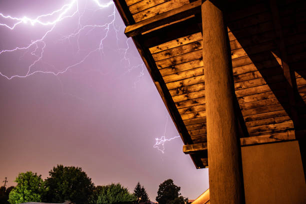 istock Lightning storm over a residential area 1210424371